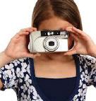 A girl taking a photo with a camera